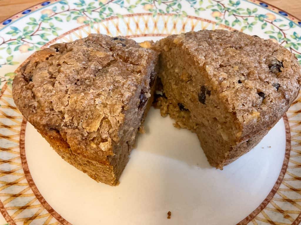 Bread pudding removed from oven dish and sliced into two portions and on serving plate.