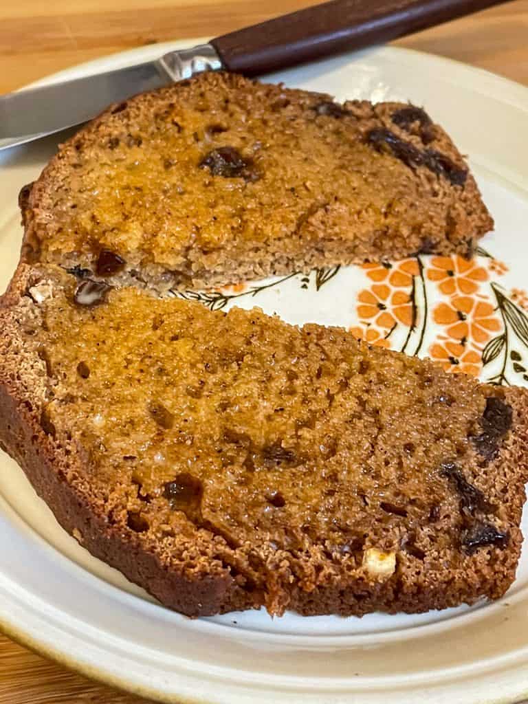 Slice of Jocks loaf toasted and buttered and on small flower patterned plate.