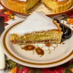 Slice of Bakewell tart on serving plate.