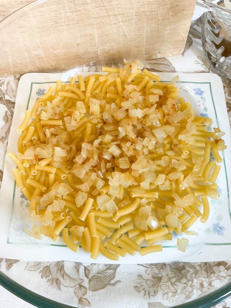 Preparing the casserole in the baking dish.